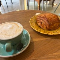 Chocolatine végane et un cappuccino au lait de coco. at Les Belles Âmes Pâtisserie in Lyon