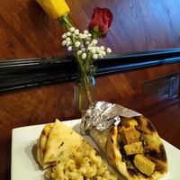 Vegan tempeh Gyro, fresh hummus, pita bread, and macaroni and cheese. at Sunflower Cafe in Fairhope