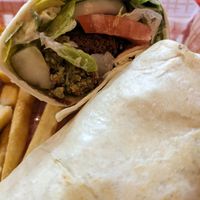 Falafel wrap (falafel, lettuce, tomato, onion, pickles, tahini, and hummus) at Chicago Grill in Appleton