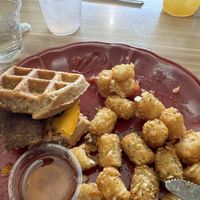 Waffle breakfast sandwich and tater tots (too excited to eat,so this photo is a little late in the meal, ha ha)  at A Lo Vegano in Orlando