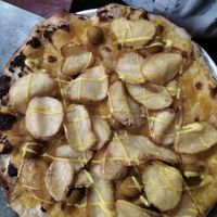 Pizza with potatoes, saffron sauce, yellow tomatoes sauce at Opera 140 - Maybe closed in Genoa
