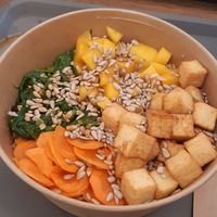 Carrots, mango, tofu, edamame, sunflower seeds, on a bed of quinoa at Ono Bowl in Delemont
