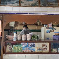 Behind the counter, the man is making your soup  at Baissara Ansara in Chefchaouen