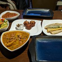 Potato sauce, rotis, taro dumplings and stir fried veg at Flavour Of Mauritius in Reading