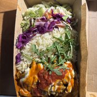 Seitan donner plate: cabbage salad, rice, saucy sliced seitann  at Just Vege - Forum in Helsinki