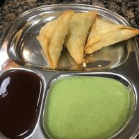 Vegetable samosa w/ tamarind sauce & cilantro sauce (lil spicy) at Bhanu's Indian Grocery and Cuisine in San Gabriel