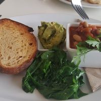 Sourdough, avocado, wilted baby spinach, house baked beans at Sprout Eden in Eden