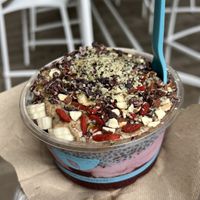 açaí, huckleberry, and chia seed pudding base with chocolate granola, almond butter, bananas, goji berries, cacao nibs, almonds, and hemp seeds  at Blue Bowl in San Diego