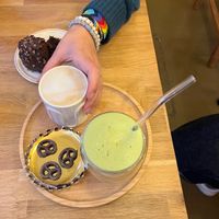 Matcha latte and other coffee drinks came with chocolate pretzel cookies. at Grignote in Pau