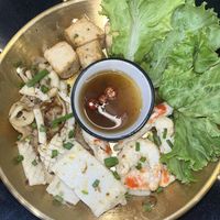 Butter grilled seafood platter with vegan squid, shrimp, tofu and mushrooms.   at Kem-Kon Pahurat (เข้ม-ข้น พาหุรัด) in Bangkok