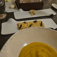 Chickpea soup and hummus cracker with olives at Bistrot 55 Classic Edition in Limassol