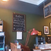 Cafe interior, showing the counter and the cake menu at The Kitchen Treasury in Kirkcaldy