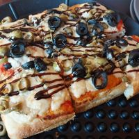 cashew cheese, red sauce, black & green olives, and balsamic glaze at Pizza Payaa in Normal