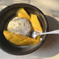 Mango sticky rice w/ yellow and red rice btw  at The Hestia Veggie in Vancouver