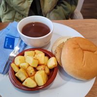 Seitan turkey & stuffing roll with fried potatoes and gravy at Pip & Oat in Llandudno