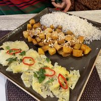 Tofu, potatoes and eggplant is some peanut sauce at Vegafe - Totoriu g. in Vilnius