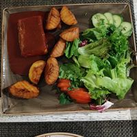 Tofu steak with potatoes and salad at Vegafe - Totoriu g. in Vilnius