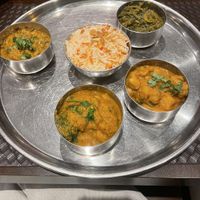 A set of 4 different curries (chickpeas, lentils, spinach, broccoli) €30 (minimum of 2 orders)- not clearly labelled but asked to veganise the 4 curry taste platter!  at Namaste Tandoori Leuven in Leuven