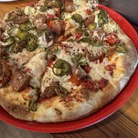 Vegan cheese, beyond sausage, jalapeño, red peppers, red onion, artichoke hearts    at Pizza Port in Carlsbad