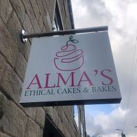 Outside sign at Alma's Ethical Cakes & Bakes in Hebden Bridge