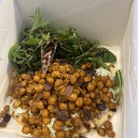 Warm chickpea flatbread to go  at Alma's Ethical Cakes & Bakes in Hebden Bridge