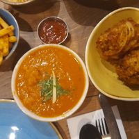Onion bhajis and a not chicken curry. at Tap & Tandor in Portsmouth
