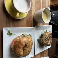 oatmilk cappuccino, maca matcha, vegan bagels with cream cheese, arugula, tomato and red onion.   at Cafe Joust  in Catskill