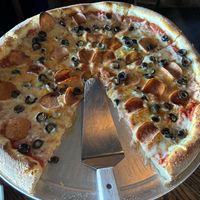 Vegan pizza with vegan pepperoni and black olives   at Damn Fine Pizza in Port Orchard