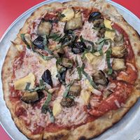 Small pizza with vegan cheese, roasted eggplant, artichoke, and basil. at Baba Louie's in Hudson