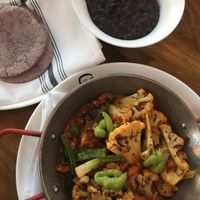 Cauliflower annatto paella 
Black beans without the cheese on the side at Mandalay Bay Hotel - Border Grill in Las Vegas