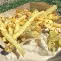 Falafel sandwich buried in Zatar fries at Noam's Table  in Cheyenne
