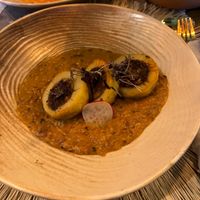 Filled potatos with veggies swimming on massala cream  at BlendHouse in Utrecht