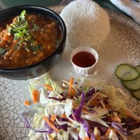 Pumpkin curry and rice with salad   at Kargo MKT in Salford