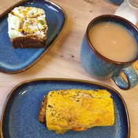 Carrot cake, oat milk tea and vegan sausage roll. at The Old Duck House in Leicester