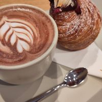 Hot chocolate with pastry and jam inside at Elias Coffee Shop in Prague