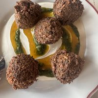 Falafel with tahini, zhoug, and amba sauce  at Safta in Denver