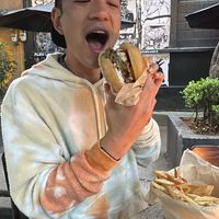 Burger was delicious! You can see the cool art in the background too. Funky place   at Los Loosers in Mexico City