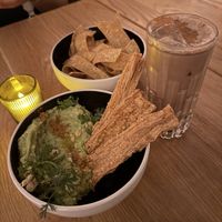 Guac and chips with horchata mocktail  at Sentir in New York City