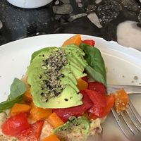 Vegan toston, with pumpkin, red peppers, humus, basil, and avocado  at Flora  in Montevideo