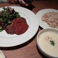 The lotus root hamburger steak dinner set (with a tomato sauce, rice, potato potage and a not-pictured soft drink) at Vegan Eat Tokyo in Tokyo