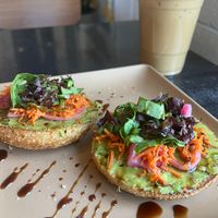 Avocado Bagel Toast special and oat milk lattee  at DOUGH  in Dayton