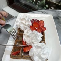 Vegan waffle with vegan chantilly cream and strawberriess  at La Maison Oflore in Montreal