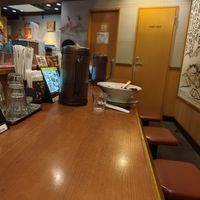 Inside, at the bar at Ramen Kiou Morinomiya in Osaka