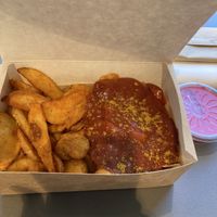 Potatoes and vegan currywurst with pink tahini dip  at boool in Dinslaken