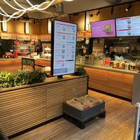 Queue   at Marugame Udon - Kensington Arcade in West London