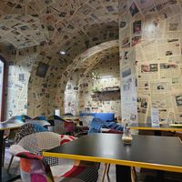 The wallpaper is made out of real newspapers 😯 at Café Localité in Brno