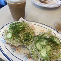 Avocado and Cucumber Sandwhich with vegan cream cheese. Iced coffee with oat milk  at Loveski Marin in Larkspur