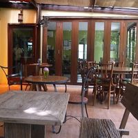 Outside seating in garden area. at Suananda Vegetarian Garden in Bangkok