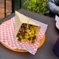 Papás bomba con toppings de seitán y chorizo at Antiburguesas in Bogota