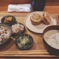 White miso soup, rice, vegetables with various sauces and fried lotus root with mushroom. at Hug Kitchen in Tokyo